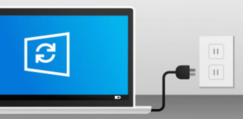 A Laptop Is Plugged Into A Wall Outlet With A Refresh Icon On The Screen GIF