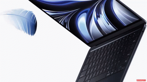 A Laptop With A Feather On The Screen And A White Background GIF