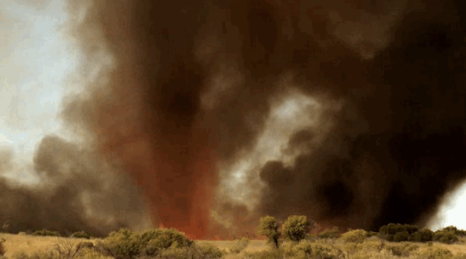 A Large Amount Of Smoke Is Coming Out Of The Sky GIF