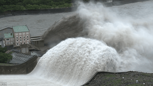 A Large Amount Of Water Is Coming Out Of A Dam And The Word Orbo Is On The Bottom Right GIF