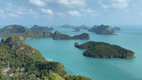 A Large Body Of Water Surrounded By Islands And Mountains GIF