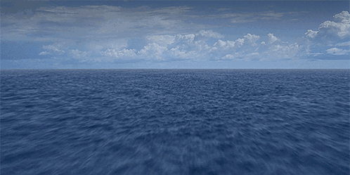 Large Water Body With Blue Sky And Clouds GIF