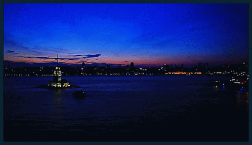 A Large Body Of Water With A Tower In The Middle Of It GIF