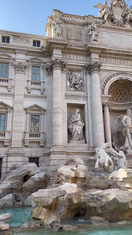 A Large Building With A Fountain In Front Of It That Says ' Triumphal Arch ' On It GIF