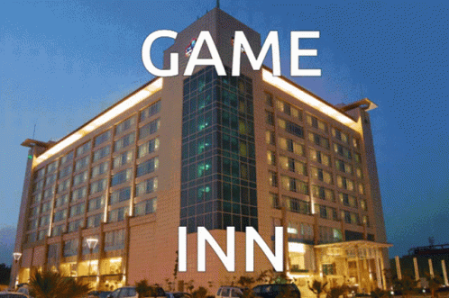 A Large Building With Game Inn Written On It GIF
