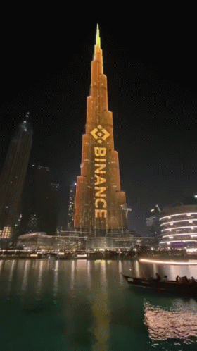 A Large Building With The Word Binance Written On It GIF