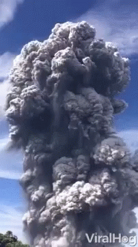 A Large Cloud Of Smoke Coming Out Of A Volcano With The Words Viralhog On The Bottom GIF