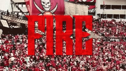 A Large Crowd Of People Are Gathered In A Stadium With The Word Fire In The Foreground . GIF