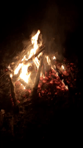 A Large Fire Is Burning In The Dark With A Lot Of Smoke GIF