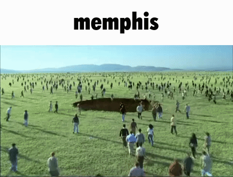a large group of people are running in a field with the word memphis in the corner