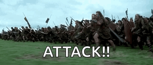 A Large Group Of Soldiers Are Marching In A Field With The Words `` Attack '' Written On The Bottom . GIF