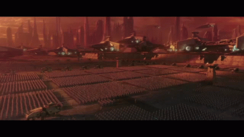 A Large Group Of Soldiers Are Standing In A Field GIF