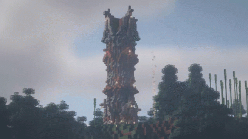A Large Minecraft Tower Is Surrounded By Trees And A Cloudy Sky GIF