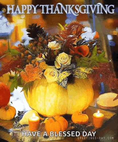 A Large Pumpkin Filled With Flowers And Candles On A Table With The Words Happy Thanksgiving Have A Blessed Day GIF