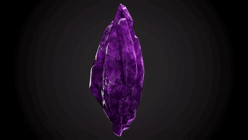 A Large Purple Crystal On A Black Background . GIF