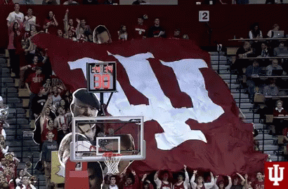 A Large Red And White Flag With The Letters Ii On It GIF