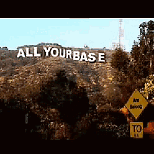 a large sign on top of a hill that says all yourbase
