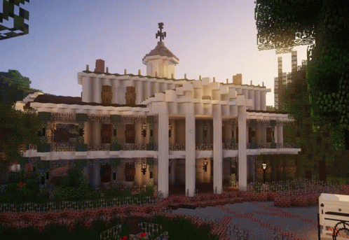 A Large White Building With A Clock Tower On Top Of It GIF