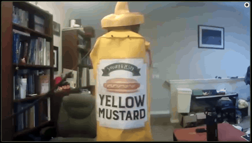 A Large Yellow Bottle Of Yellow Mustard In A Room GIF