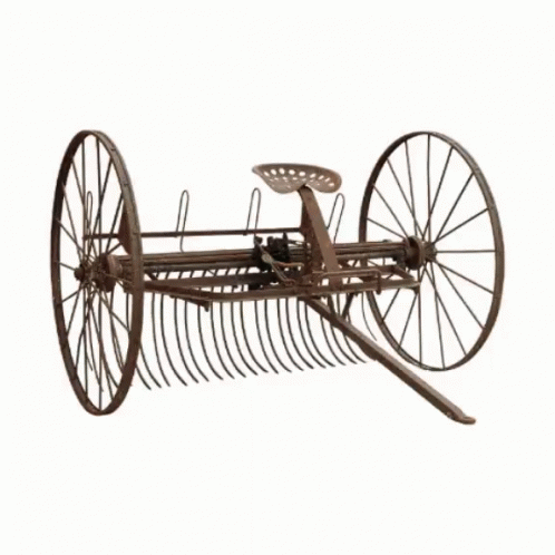 A Large Yellow Bulldozer With Chains On The Wheels GIF