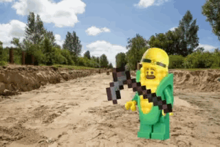 Lego Character In Corn Costume Holding Axe GIF