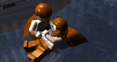 A Lego Figure With A Cross On His Face Is Laying On The Ground GIF