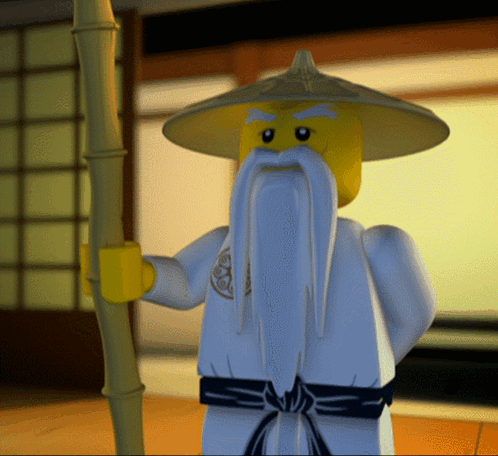 A Lego Figure With A Long Beard And A Yellow Hat GIF