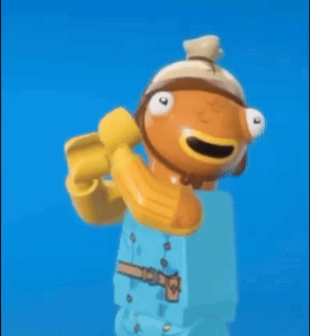 A Lego Fish With A Banana On His Head Is Holding A Banana . GIF