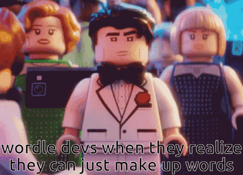 A Lego Man In A Tuxedo And Bow Tie Stands In Front Of A Crowd GIF