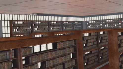 A Library With Lots Of Books On Shelves And A Balcony GIF