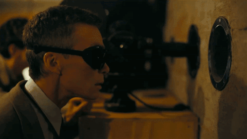 A Light Is Shining On A Dark Background In The Shape Of A Heart GIF