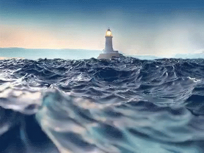 A Lighthouse In The Middle Of The Ocean With Waves Crashing Around It GIF