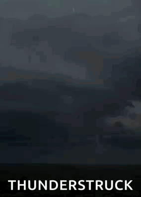 A Lightning Bolt Is Hitting The Ground In The Middle Of A Field With The Words Thunderstruck Below It . GIF