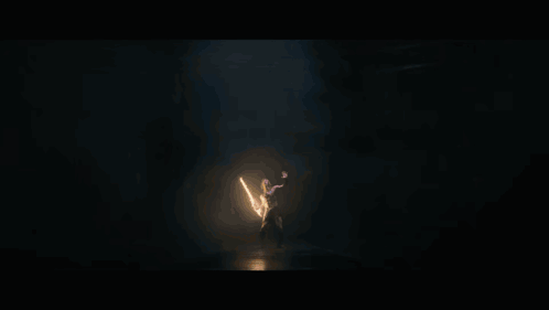 A Lightning Bolt Strikes A Person In A Dark Cave GIF