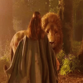 A Lion Is Biting A Person 'S Leg In A Dark Forest GIF