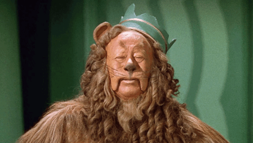A Lion With A Green Crown On His Head GIF