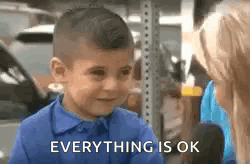 A Little Boy In A Blue Shirt Is Crying While Talking To A Woman And Says `` Everything Is Ok '' . GIF