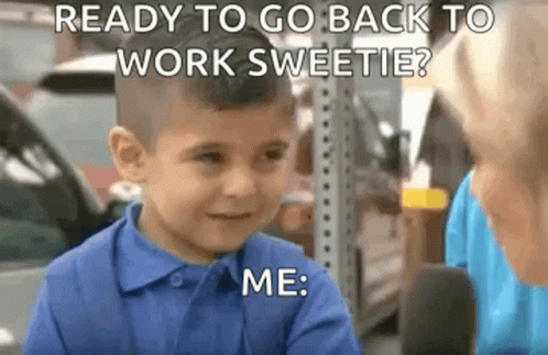 A Little Boy In A Blue Shirt Is Sitting In Front Of A Microphone . GIF