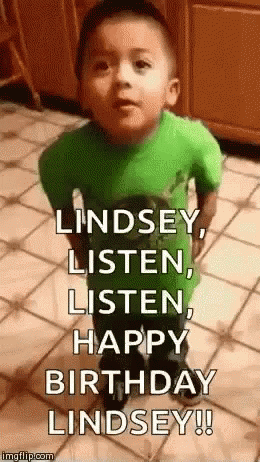 A Little Boy In A Green Shirt Is Standing On A Tiled Floor And Making A Funny Face . GIF