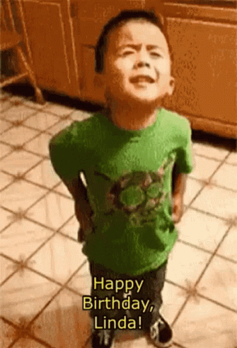 A Little Boy In A Green Shirt Is Standing On A Tiled Floor And Saying Happy Birthday Linda GIF