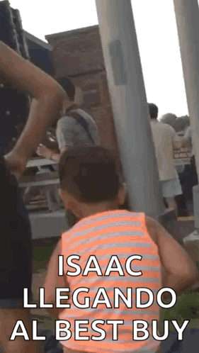A Little Boy In An Orange And White Striped Tank Top Says Isaac Llegando Al Best Buy In Spanish GIF
