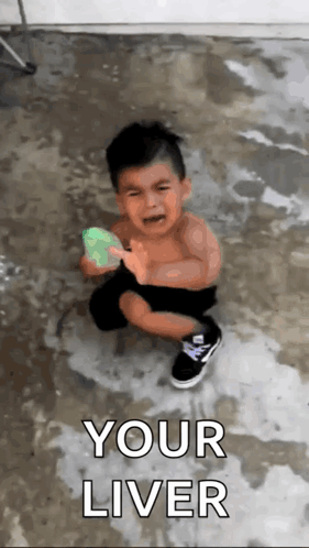 A Little Boy Is Crying While Holding A Water Balloon With The Words " Your Liver " On The Bottom GIF