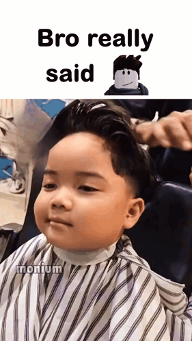 A Little Boy Is Getting His Hair Cut In A Barber Shop GIF