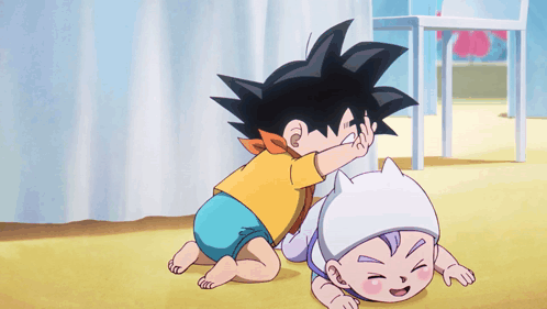 A Little Boy Is Playing With A Baby In A Diaper GIF