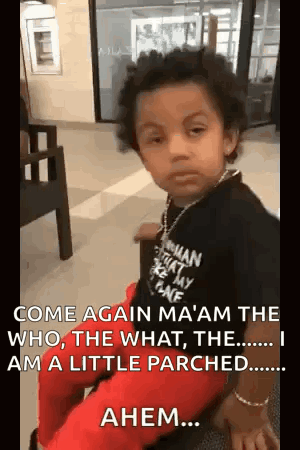 A Little Boy Is Sitting On A Chair In A Waiting Room . GIF