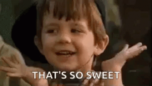 A Little Boy Is Smiling And Saying `` That 'S So Sweet '' With His Hands Outstretched . GIF
