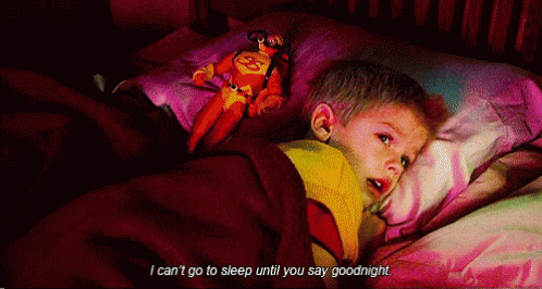 A Little Boy Laying In Bed With A Stuffed Superman On His Pillow And The Words I Can 'T Go To Sleep GIF