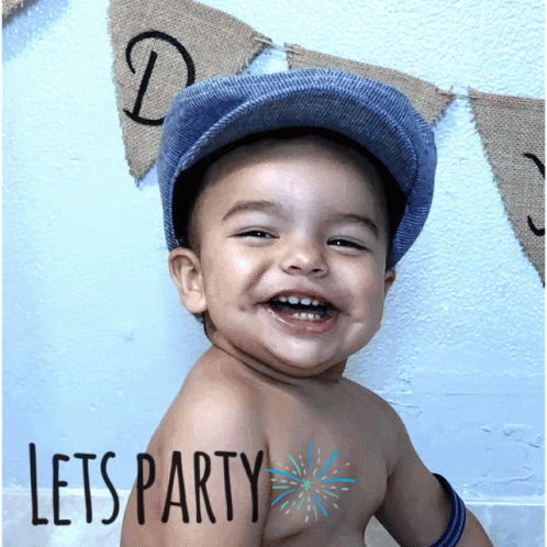 A Little Boy Wearing A Hat Is Smiling With The Words Let 'S Party Written On His Chest GIF