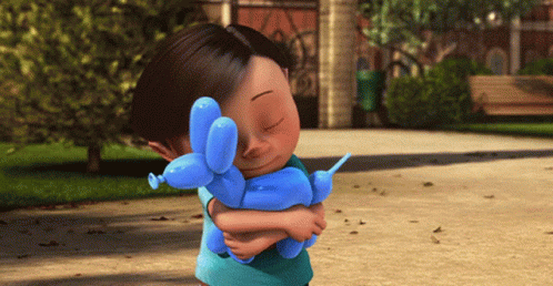A Little Girl Holding A Blue Balloon Dog GIF