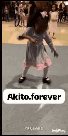 A Little Girl In A Dress Is Dancing On A Dance Floor With A Sign That Says Akito Forever . GIF